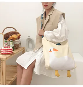 Cute cartoon duck canvas shoulder bag, large capacity casual tote bag with contrast strap.