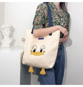 Cute cartoon duck canvas tote bag with 3D feet, large capacity casual shoulder bag.