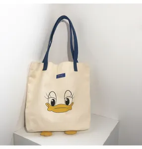 Canvas tote bag with cute duck face design, blue handles, large capacity, casual daily bag.