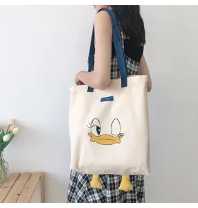 Cute casual canvas shoulder bag with lovely cartoon duck design and large capacity space.