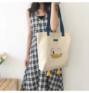 Canvas tote bag large capacity casual shoulder bag with cute duck face design and navy handles
