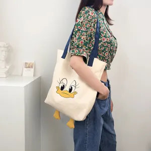 Cute cartoon duck canvas tote bag, large capacity casual contrast color shoulder bag for daily use.