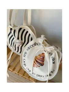 Ästhetische Canvas-Tragetasche mit künstlerischem Croissant-Druck und Buchstaben, lässige Tasche.
