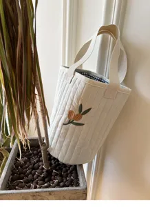 Beige quilted bucket bag with cute olive embroidery and check lining for daily use.