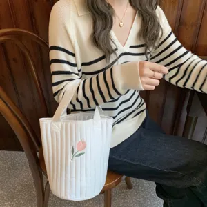 Korean style quilted bucket bag with cute tulip embroidery, versatile white tote for daily use.