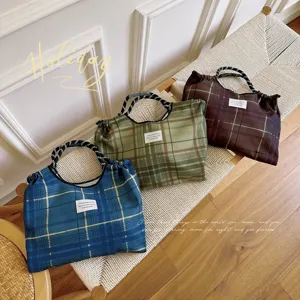 Korean style cotton plaid large capacity cradle shoulder tote bag for women daily use.