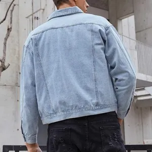 Detailed view of men's light blue denim jacket, casual turn-down collar, stylish outerwear.