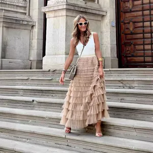 Stylish women's tulle tiered maxi skirt, elegant layered mesh cake skirt for summer fashion.