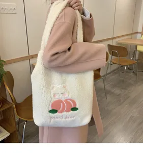 Cute fuzzy tote bag with sweet peach bear embroidery for autumn and winter daily use.