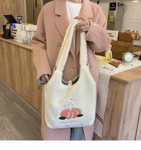 Cute plush shoulder bag for women, large capacity fluffy tote with sweet peach bear embroidery.