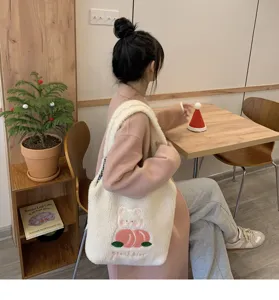 Cute plush shoulder bag with cartoon bear and peach embroidery for autumn and winter daily use.