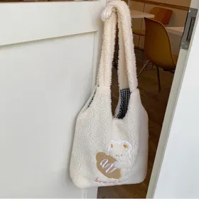Cute fluffy sherpa shoulder bag featuring an adorable embroidered bear design for daily use.
