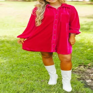 Detailed shot of women vibrant pink velvet oversized button down shirt dress outdoor view