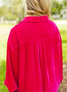 Detailed back view of women hot pink velvet long sleeve casual loose button-up shirt top.