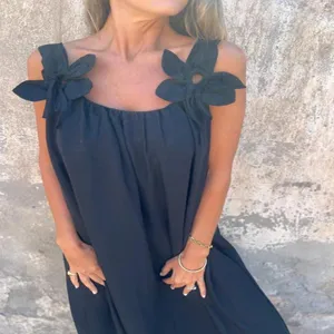 Chic black summer maxi dress for women featuring stylish floral shoulder straps and sleeveless cut.
