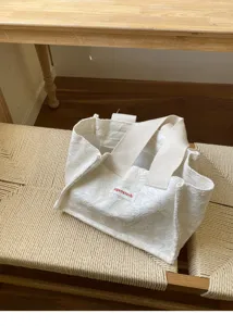 Korean style minimalist white canvas tote bag, mini portable handbag and casual storage pouch.