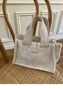 Mini canvas tote bag with floral embroidery, portable hand-held storage handbag for daily use.