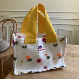 Mini canvas tote bag with yellow handles and floral embroidery, cute casual handbag for women.