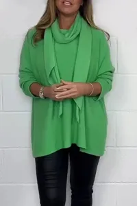 Detail view of a solid green knit pullover sweater with matching scarf for autumn winter fashion.