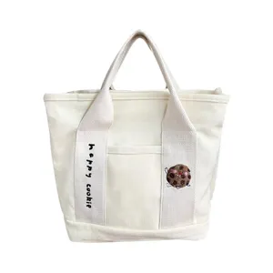 Canvas tote bag with cute cookie embroidery and dual handles for daily casual student use.