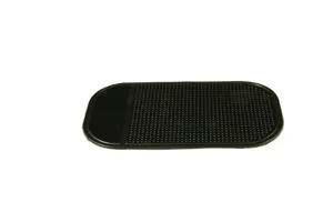 Detail view of a black silicone car anti-slip mat with sticky grid surface for mobile phones.