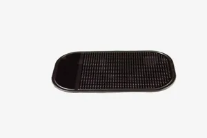 Detailed view of black anti-slip car mat surface texture and grid pattern design.