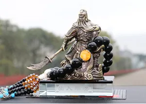 Car dashboard ornament featuring Guan Yu brass statue with prayer beads crystal base.