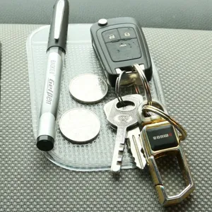 Transparent car dashboard anti-slip sticky pad, strong grip silicone mat for phone and keys.