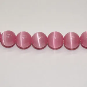 Pink cat eye gemstone crystal beads detail close up for DIY handmade jewelry making.