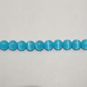 Blue cat eye beads for DIY jewelry making, ideal for handmade bracelets and necklaces.