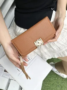 Classic brown PU leather long wallet for women with elegant metal buckle and stylish tassel clutch design.