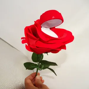 Red velvet rose flower ring box with stem for proposal, engagement and jewelry gift packaging.