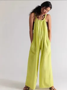Lime green loose fit overall jumpsuit detail view featuring adjustable straps and pockets.