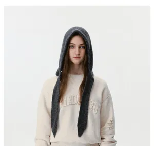 Detailed view of the cozy knit hooded scarf in dark grey, featuring soft texture and warm design.