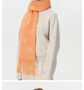 Elegante Damen Winterschal mit Perlen Schleife und Quasten, warmer Strick Schal in Orange
