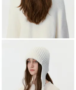 Detail view of women winter warm wool knit earflap hat with cute braided ear design.