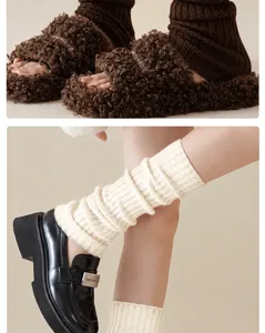 Knit leg warmers and cozy winter socks detailed view, soft wool blend ribbed texture.