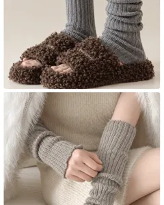 Knit leg warmers and plush slippers detail shot, soft wool blend ribbed winter thermal socks.
