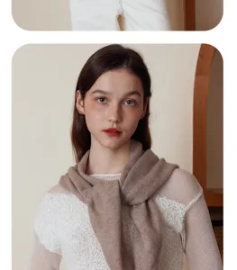 Detail view of a solid color cashmere wool knit triangle scarf, soft and warm for autumn winter.