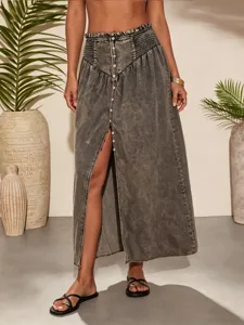 Summer bohemian washed black denim maxi skirt for women with front slit and high waist.