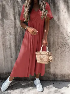 Stylish women's short sleeve red midi dress with cross v-neck design for casual summer wear.