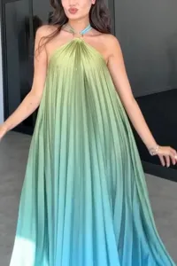 Close-up detail of women halter sleeveless pleated maxi dress with stunning gradient color.
