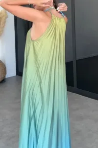 Detailed view of the sleeveless halter pleated long dress in green blue ombre design.