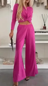 Detail view of the vibrant pink casual long-sleeve crop top and wide leg trouser set.