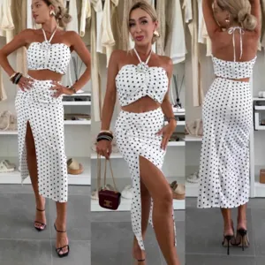 Stylish women polka dot halter crop top and high slit midi skirt two piece set summer fashion.