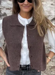 Detail shot of a stylish brown knit vest with lapel, perfect for autumn casual outfit styling.