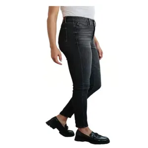 Detail view of women's stylish mid-rise washed black skinny denim jeans showcasing fit.