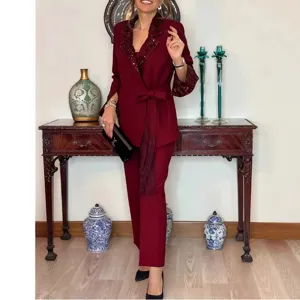 Elegant two-piece pantsuit featuring a sequin lapel blazer and matching long trousers.