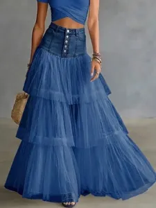 Detail view of blue denim tulle spliced maxi skirt with layered tiered design and high waist.