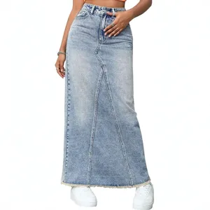 High waist denim long skirt detail, showing raw frayed hem and panel stitching design.